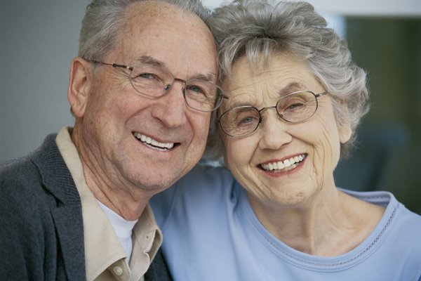 A smiling elderly couple